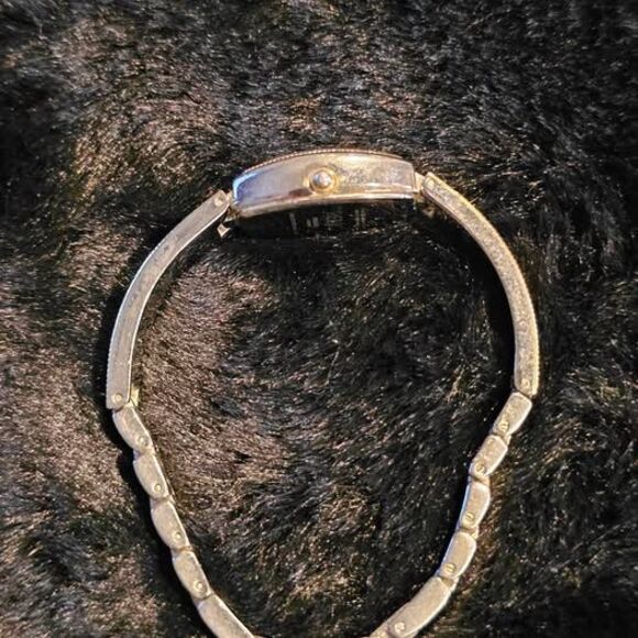 Vintage Relic ladies silvertone watch with southern style band.